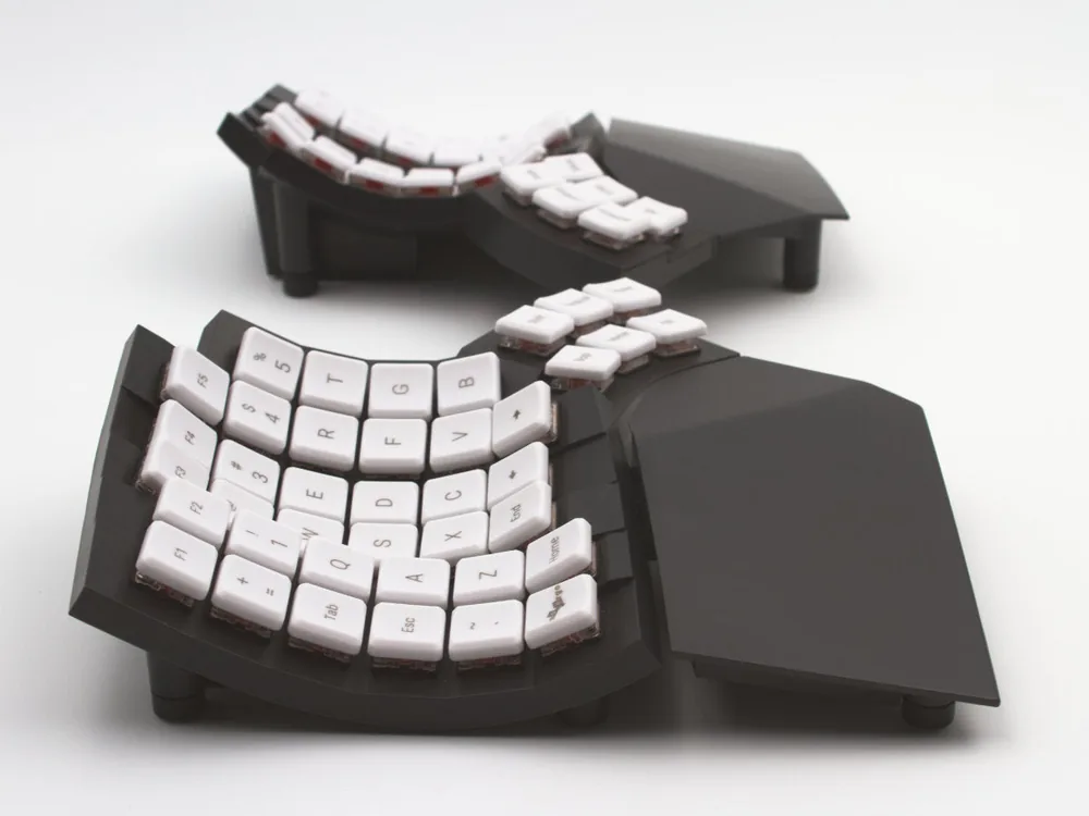 MoErgo Glove80 wireless split keyboard with concave keywells that reduce finger reach